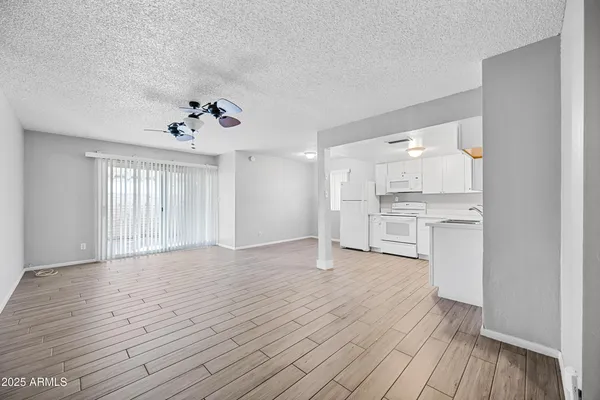 a view of kitchen with wooden floor and window