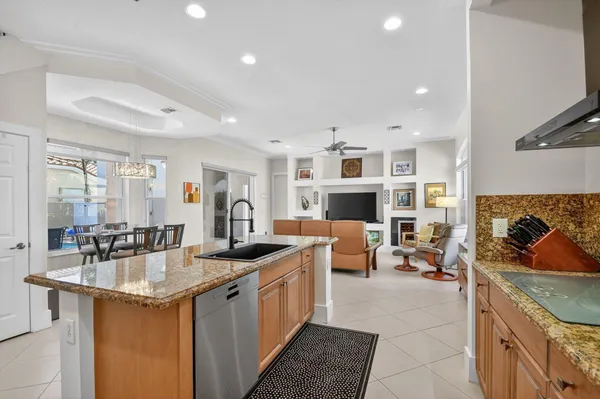 a bedroom with a large bed couch and a window