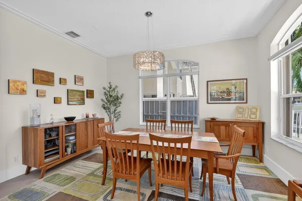 a bedroom with a large bed and a lamp on table