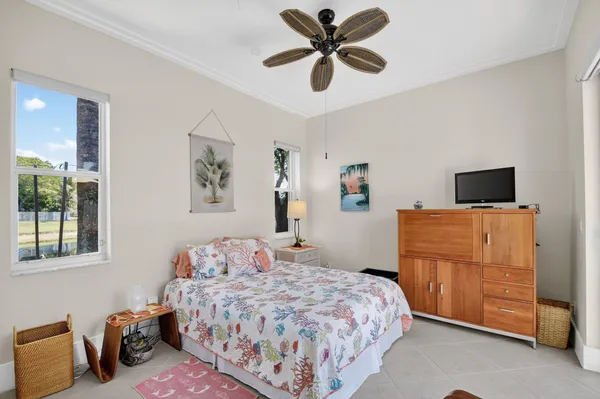 a bathroom with a granite countertop sink toilet and mirror