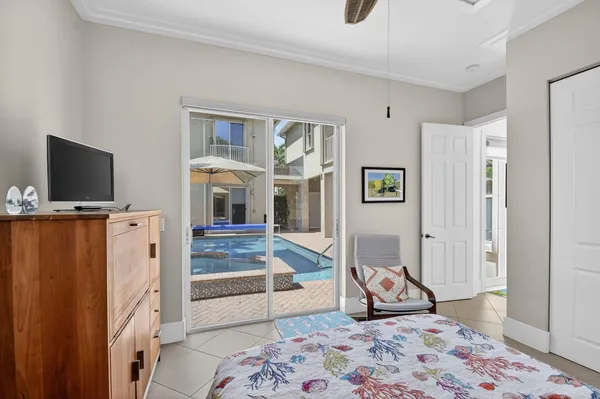 a view of a house with backyard and a tree