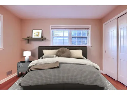 a bedroom with a bed and window