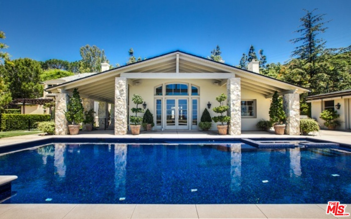 12801 Chalon Road Los Angeles, CA 90049 - Photo 13 of 16 a view of a house with a outdoor space