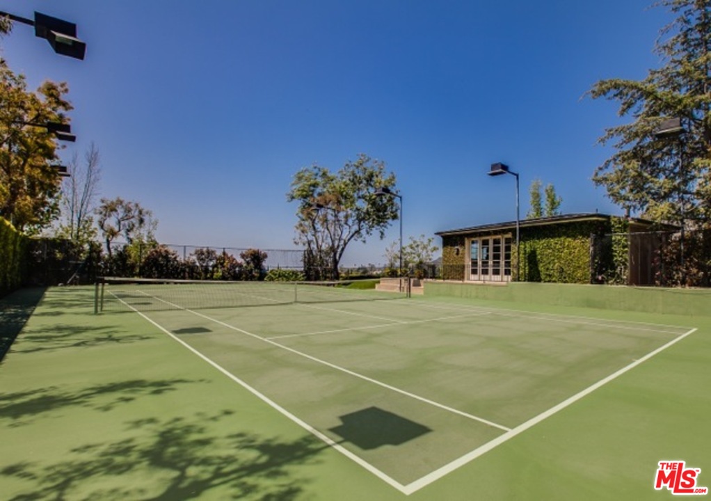 12801 Chalon Road Los Angeles, CA 90049 - Photo 16 of 16 a view of an outdoor space and tennis court