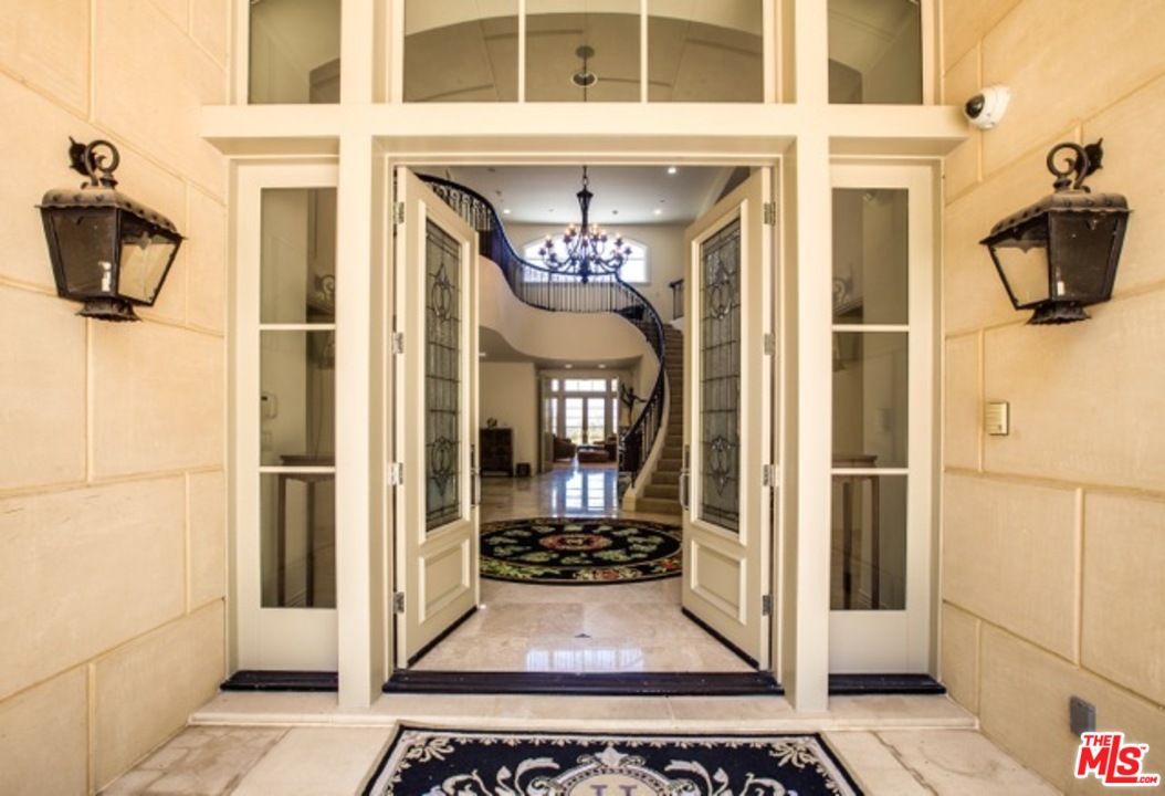 12801 Chalon Road Los Angeles, CA 90049 - Photo 8 of 16 a view of a entryway door of the house