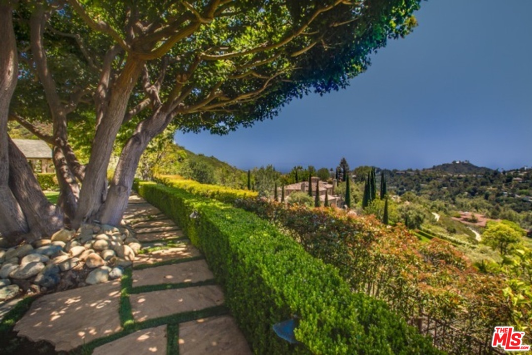 12801 Chalon Road Los Angeles, CA 90049 - Photo 10 of 16 a view of a yard