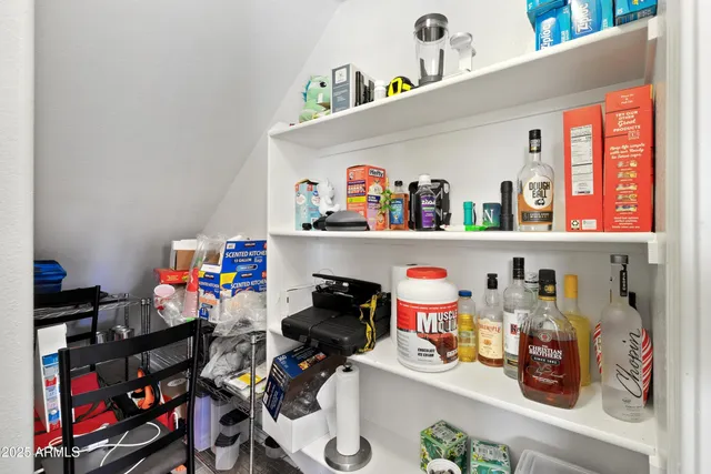a room with toys and white cabinets