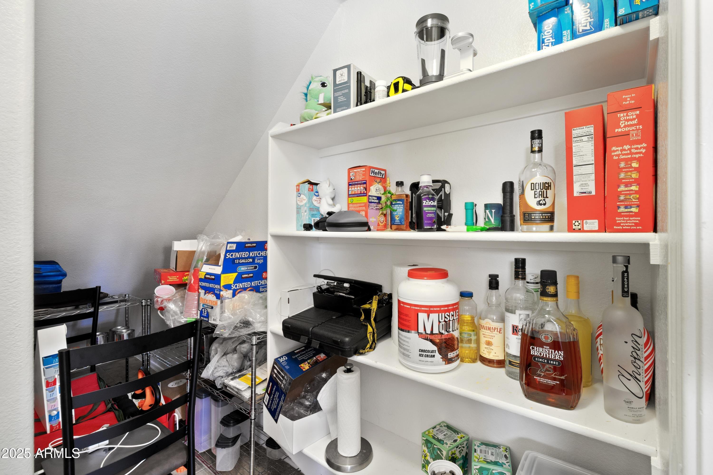2727 North Price Road, Unit 50 Chandler, AZ 85224 - Photo 11 of 32 a room with toys and white cabinets