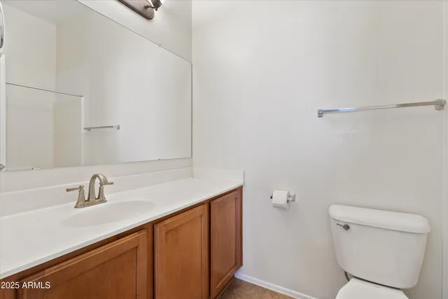 a bathroom with a sink toilet and vanity