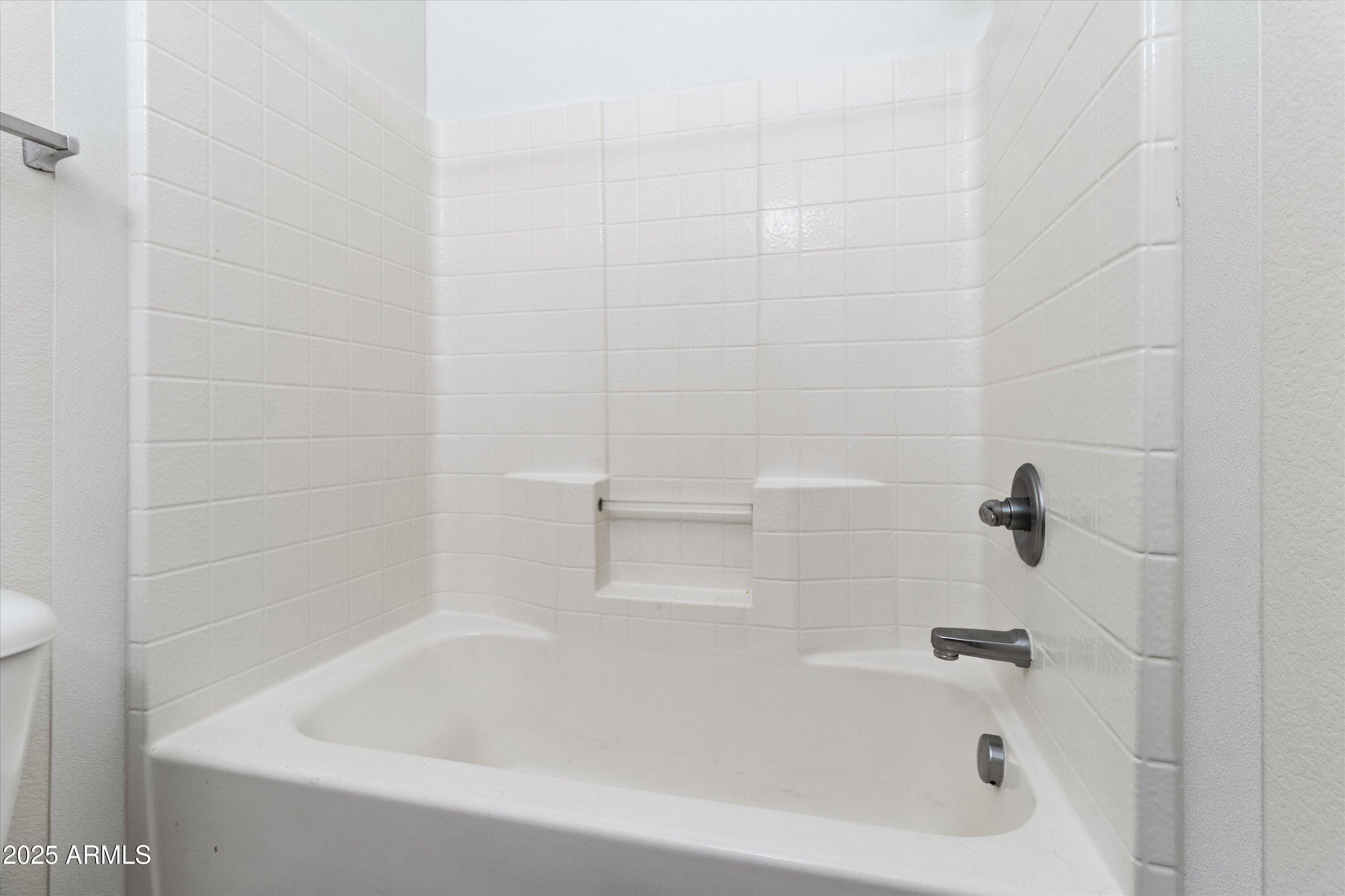 2727 North Price Road, Unit 50 Chandler, AZ 85224 - Photo 15 of 32 a bathroom with a bathtub