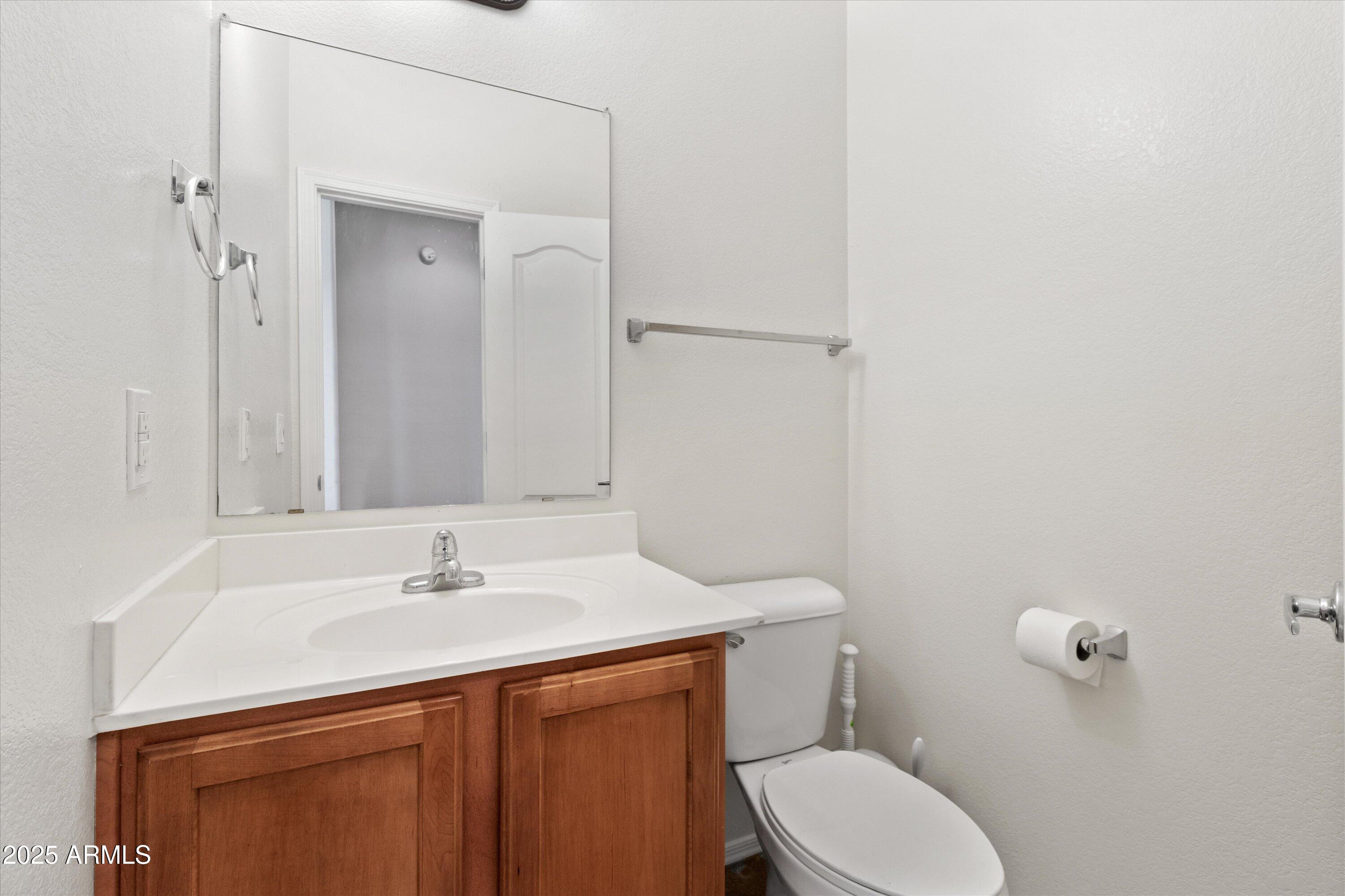 2727 North Price Road, Unit 50 Chandler, AZ 85224 - Photo 20 of 32 a bathroom with a sink toilet and vanity