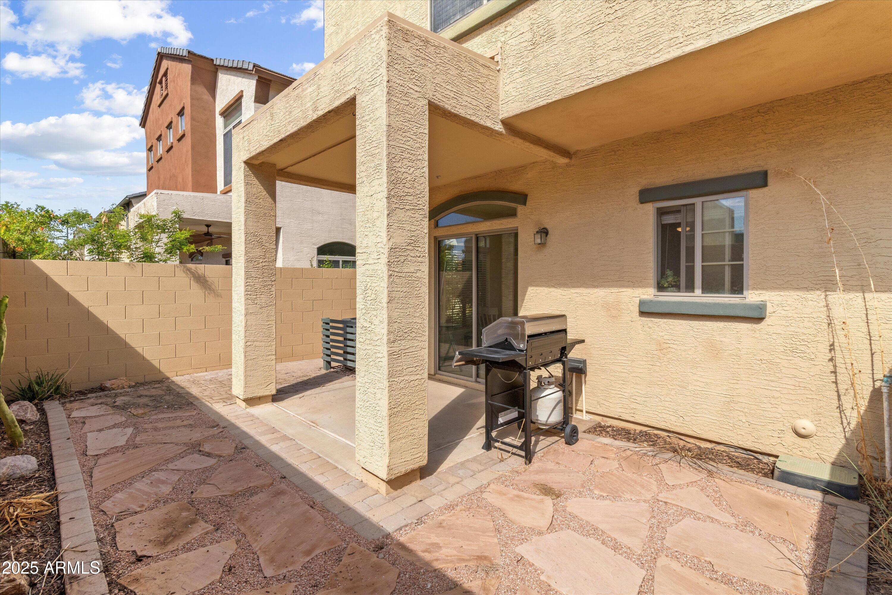 2727 North Price Road, Unit 50 Chandler, AZ 85224 - Photo 21 of 32 a view of a house with backyard and sitting area