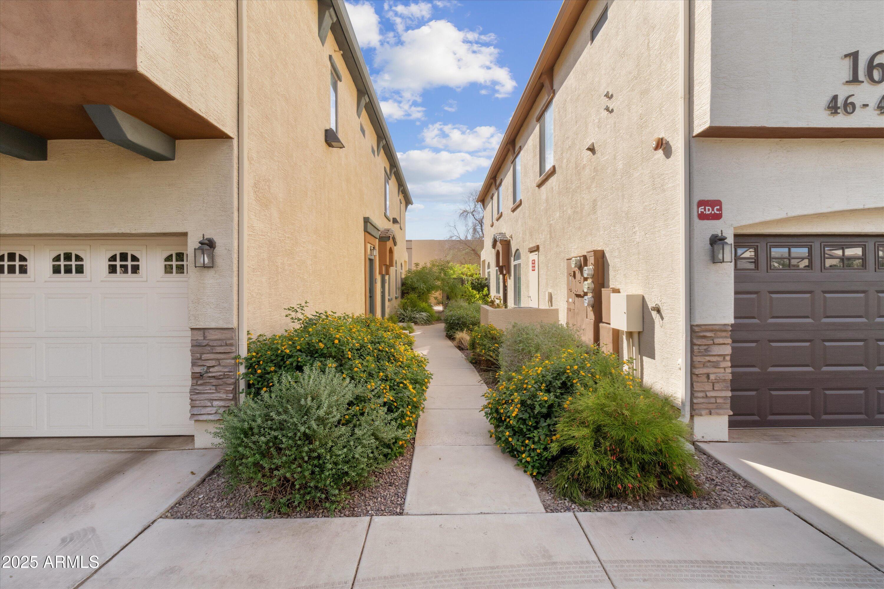 2727 North Price Road, Unit 50 Chandler, AZ 85224 - Photo 28 of 32 a view of path along with building