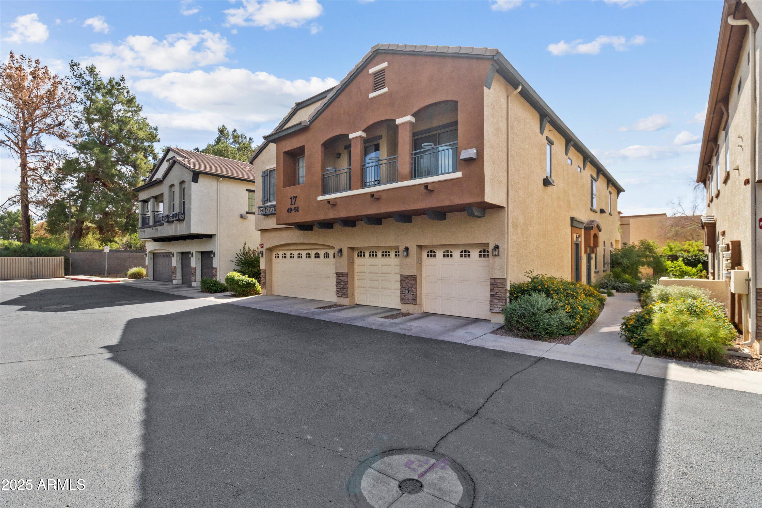 2727 North Price Road, Unit 50 Chandler, AZ 85224 - Photo 29 of 32 a front view of a house with garden