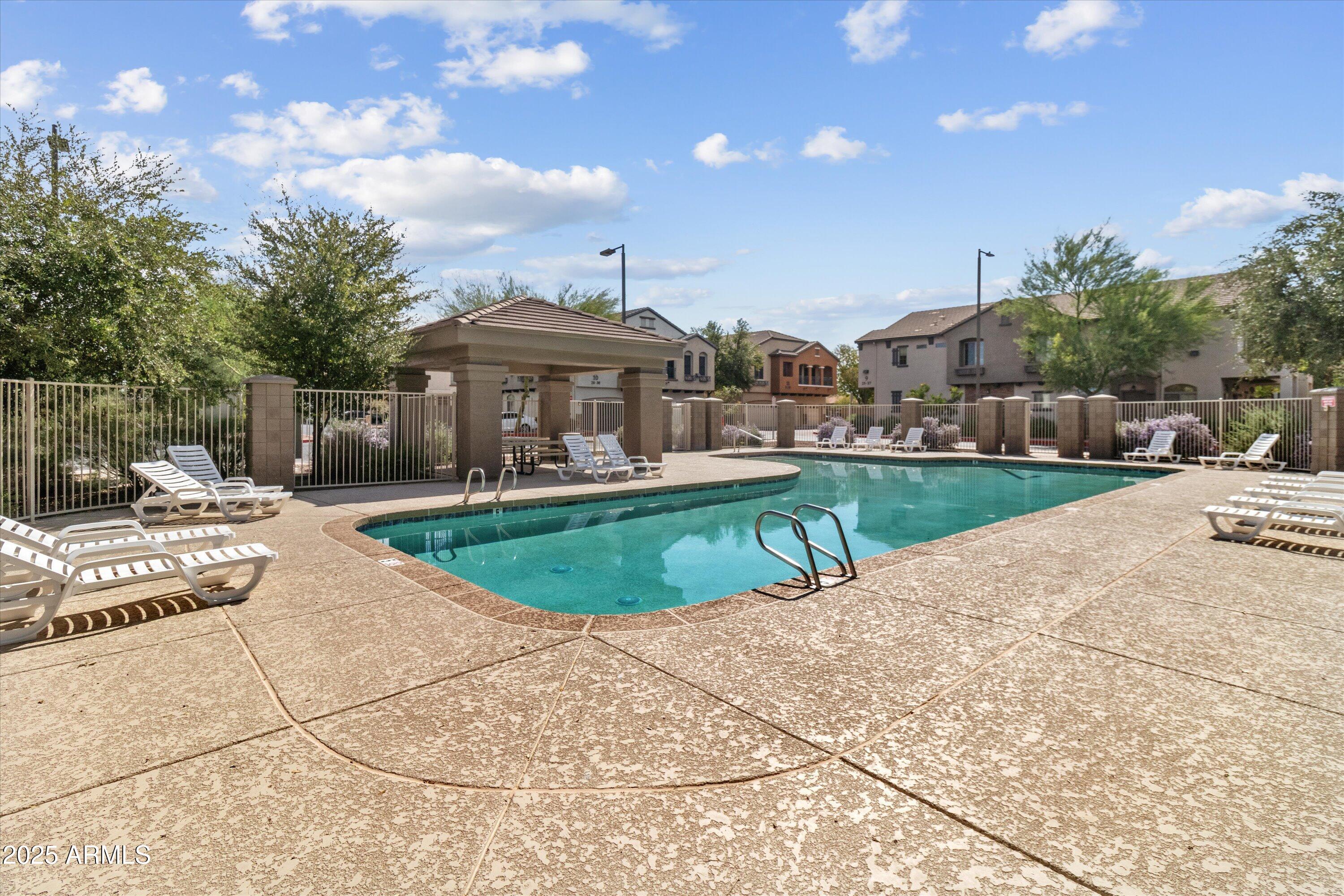 2727 North Price Road, Unit 50 Chandler, AZ 85224 - Photo 31 of 32 a view of a house with a patio