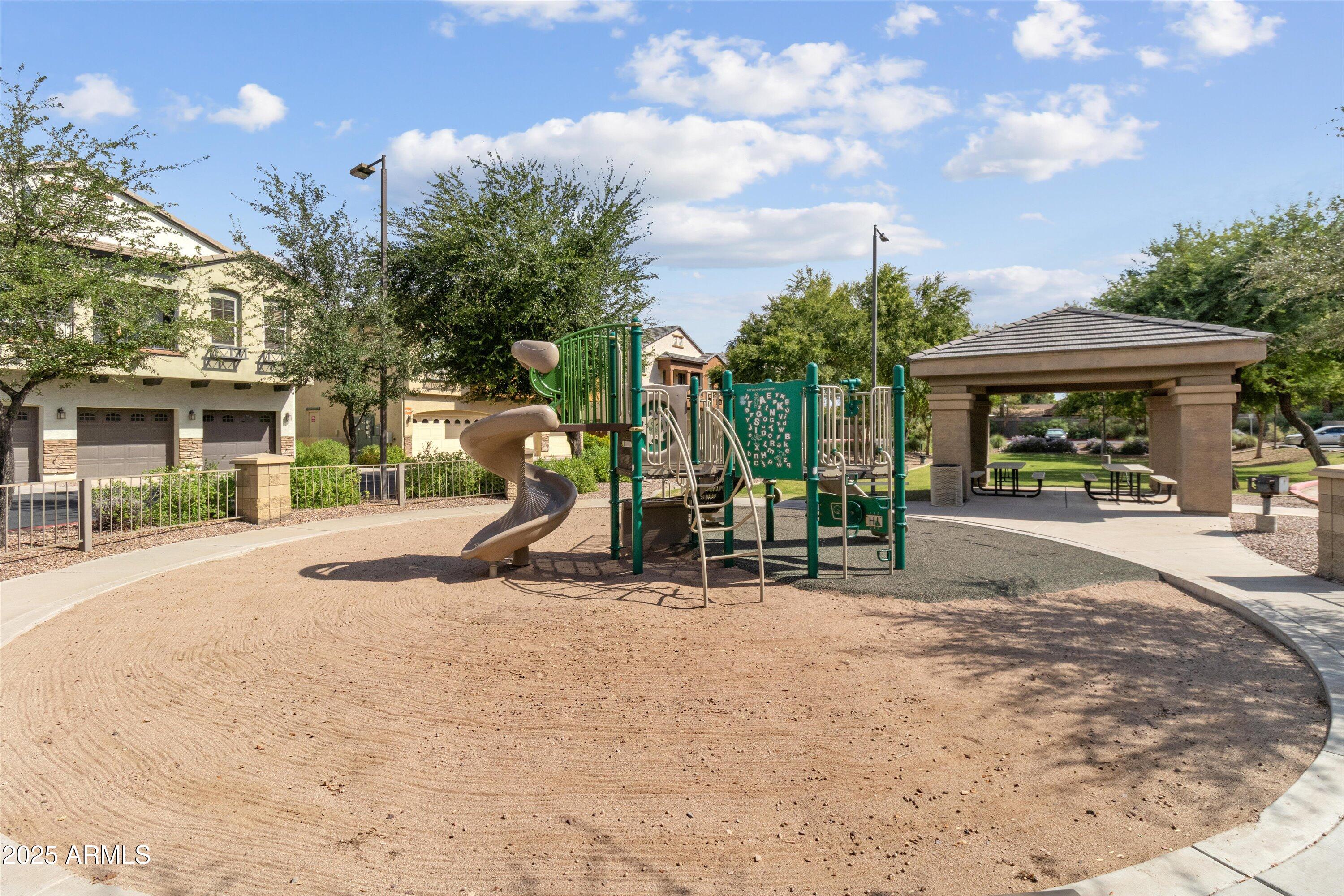 2727 North Price Road, Unit 50 Chandler, AZ 85224 - Photo 32 of 32 a view of a park with swings and slides