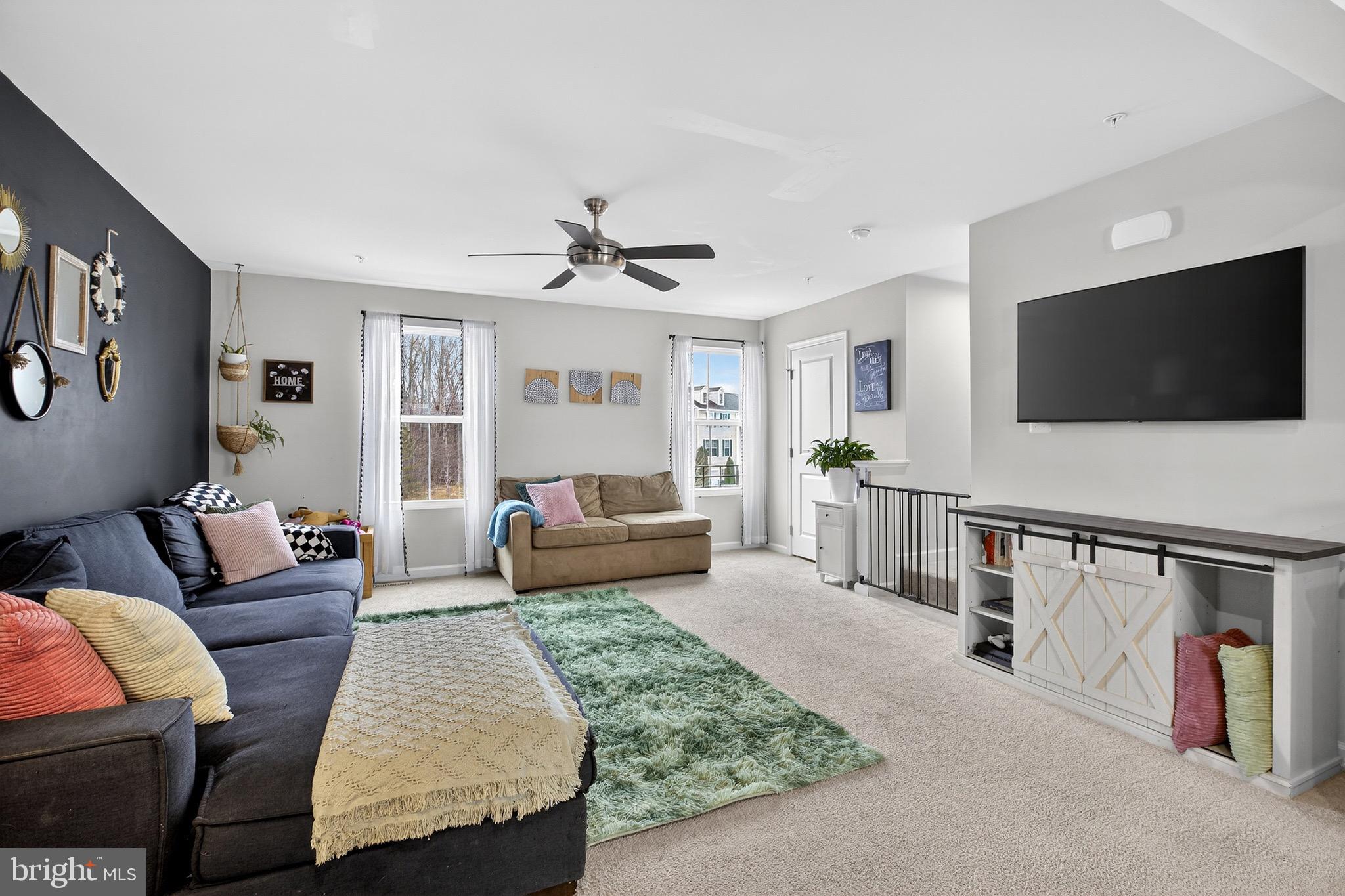 34 Blackgum Road Elkton, MD 21921 - Photo 12 of 37 a living room with furniture and a flat screen tv