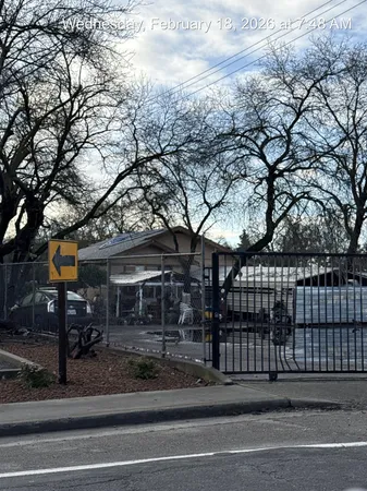a view of a house with a iron fence