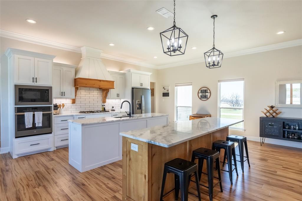 296 Mesquite Ridge Lane Lawn, TX 79530 - Photo 7 of 35 a large kitchen with a table and chairs in it