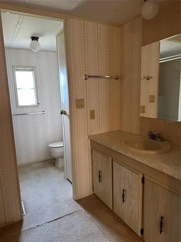 an empty room with a bathroom
