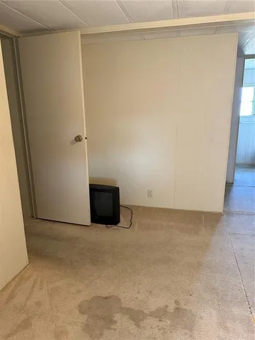 a bathroom with a granite countertop sink mirror and a toilet