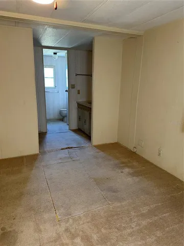 a view of a storage & utility room with closet area