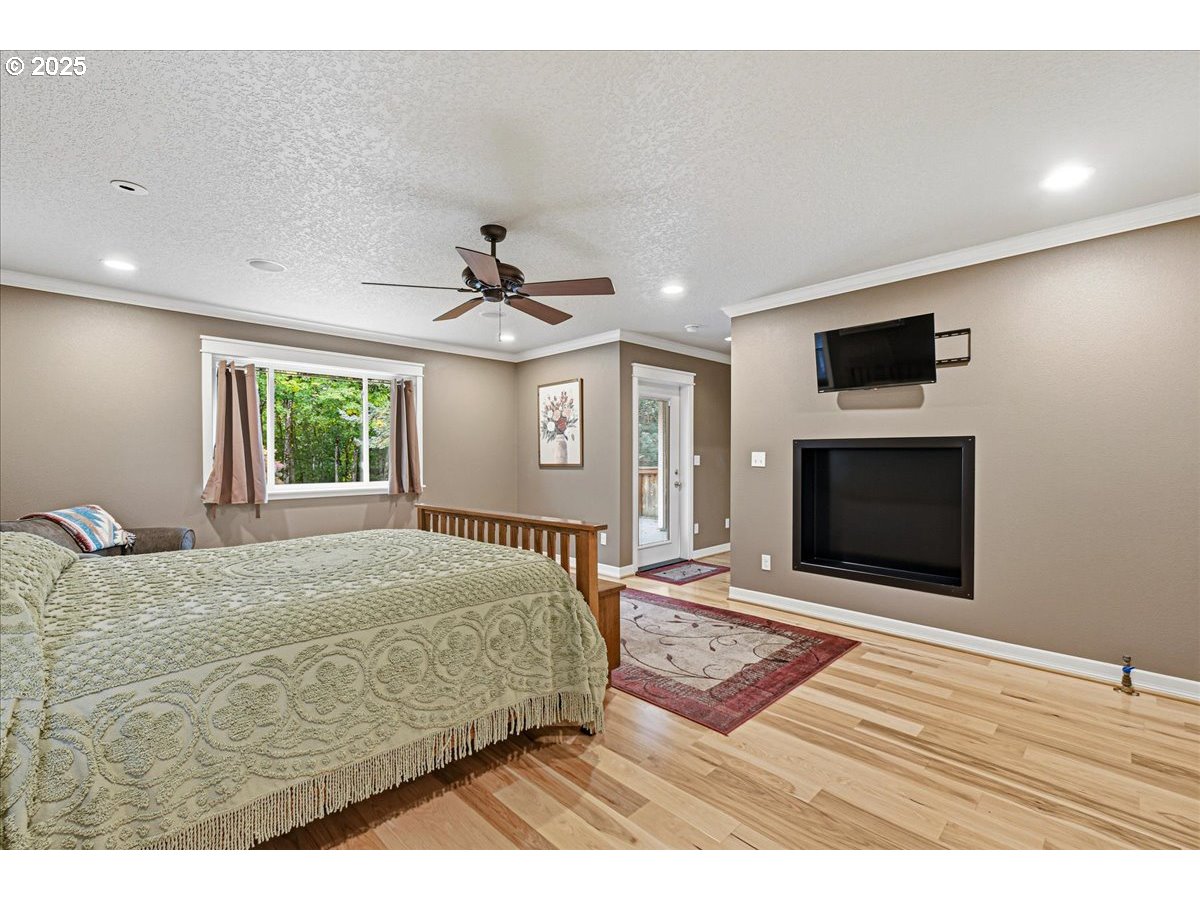 1820 Southwest Heiney Road Gresham, OR 97080 - Photo 22 of 48 a bedroom with a bed and a flat screen tv