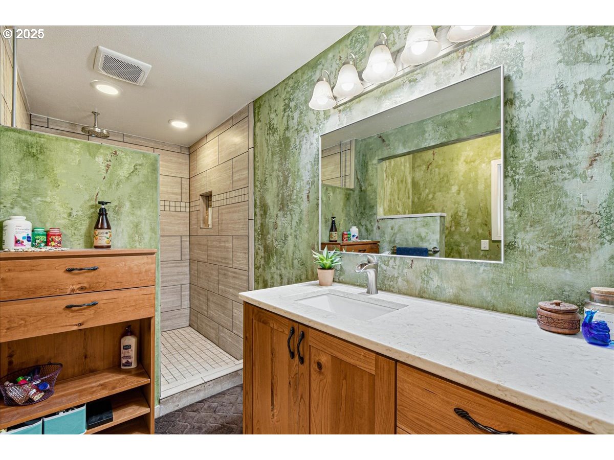 1820 Southwest Heiney Road Gresham, OR 97080 - Photo 24 of 48 a bathroom with a sink double vanity and a shower