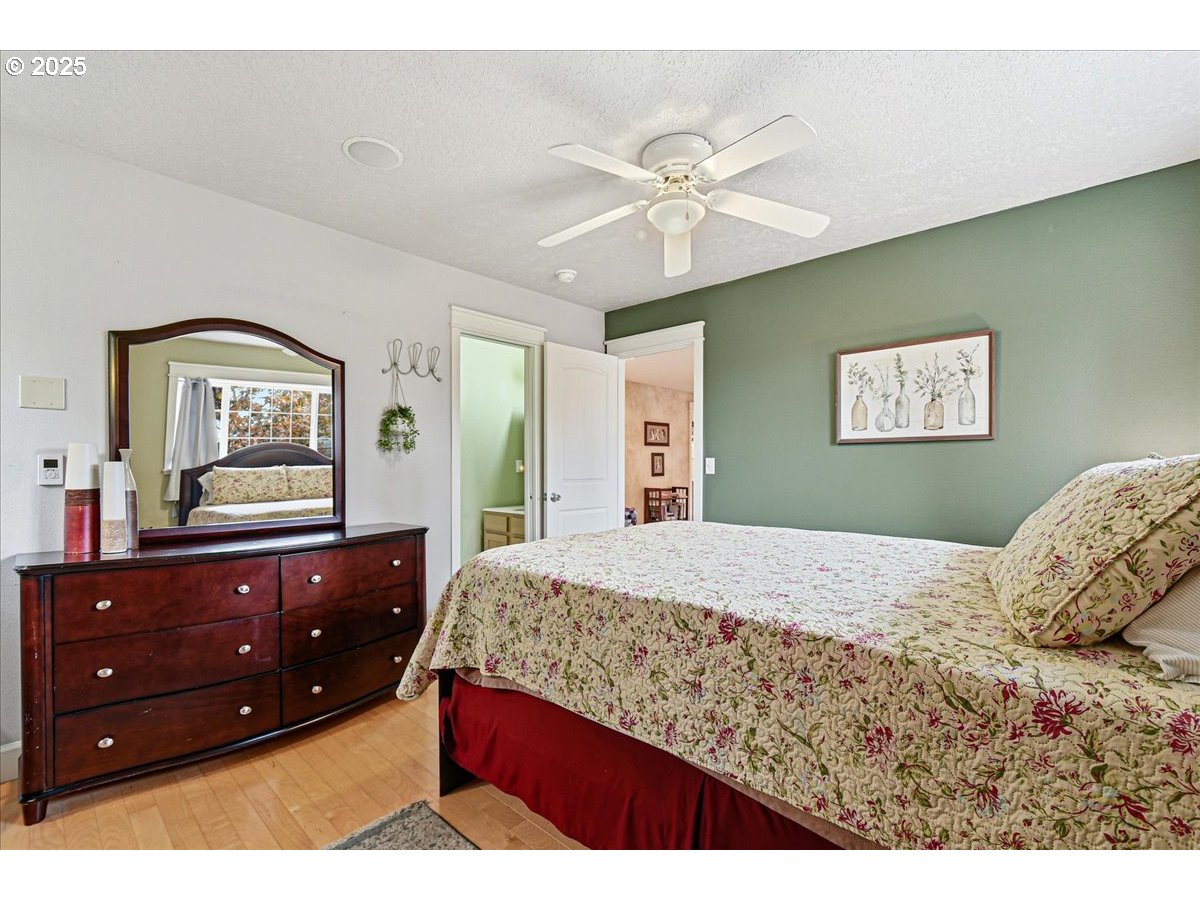 1820 Southwest Heiney Road Gresham, OR 97080 - Photo 30 of 48 a bedroom with a bed and a dresser