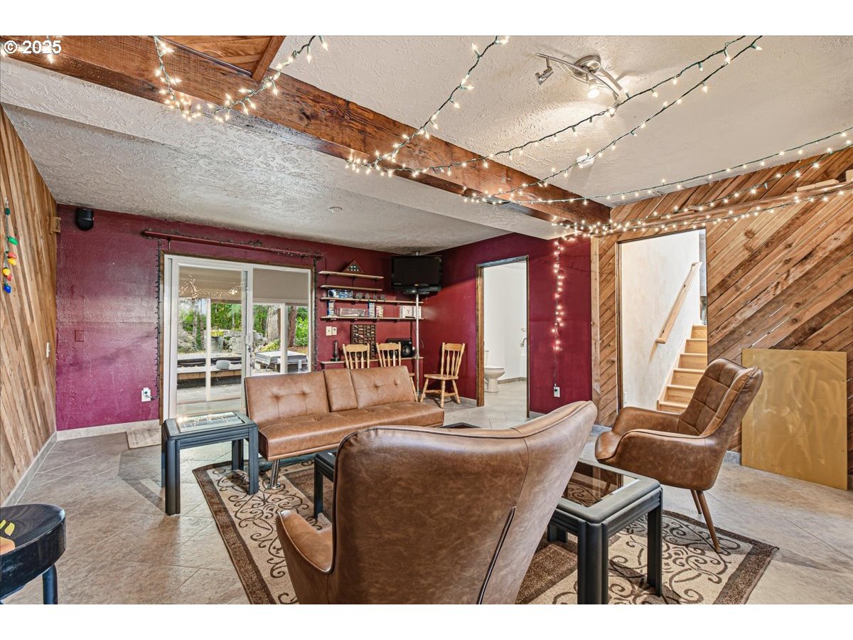 1820 Southwest Heiney Road Gresham, OR 97080 - Photo 35 of 48 a dining room with furniture and a chandelier