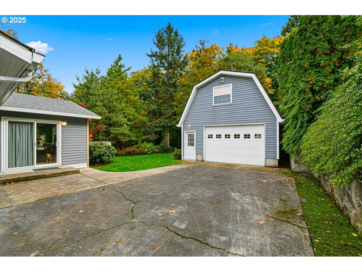 1820 Southwest Heiney Road Gresham, OR 97080 - Photo 41 of 48 a view of a house with a yard and potted plants