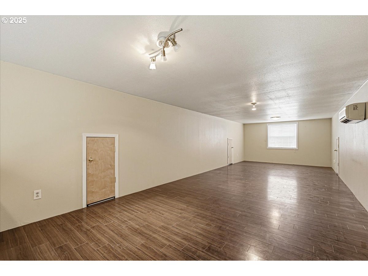 1820 Southwest Heiney Road Gresham, OR 97080 - Photo 44 of 48 a view of a livingroom with wooden floor