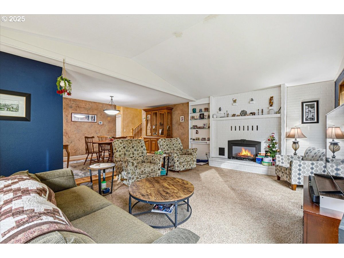 1820 Southwest Heiney Road Gresham, OR 97080 - Photo 9 of 48 a living room with furniture and a fireplace