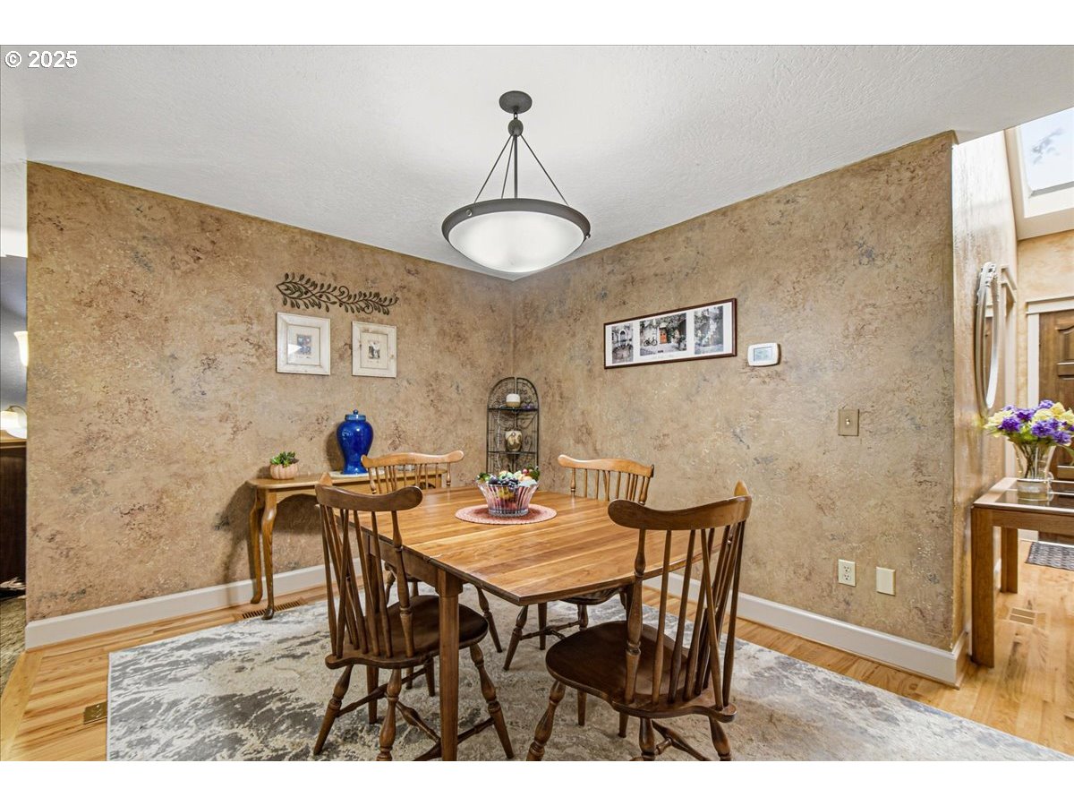 1820 Southwest Heiney Road Gresham, OR 97080 - Photo 10 of 48 a view of a dining room with furniture and wooden floor
