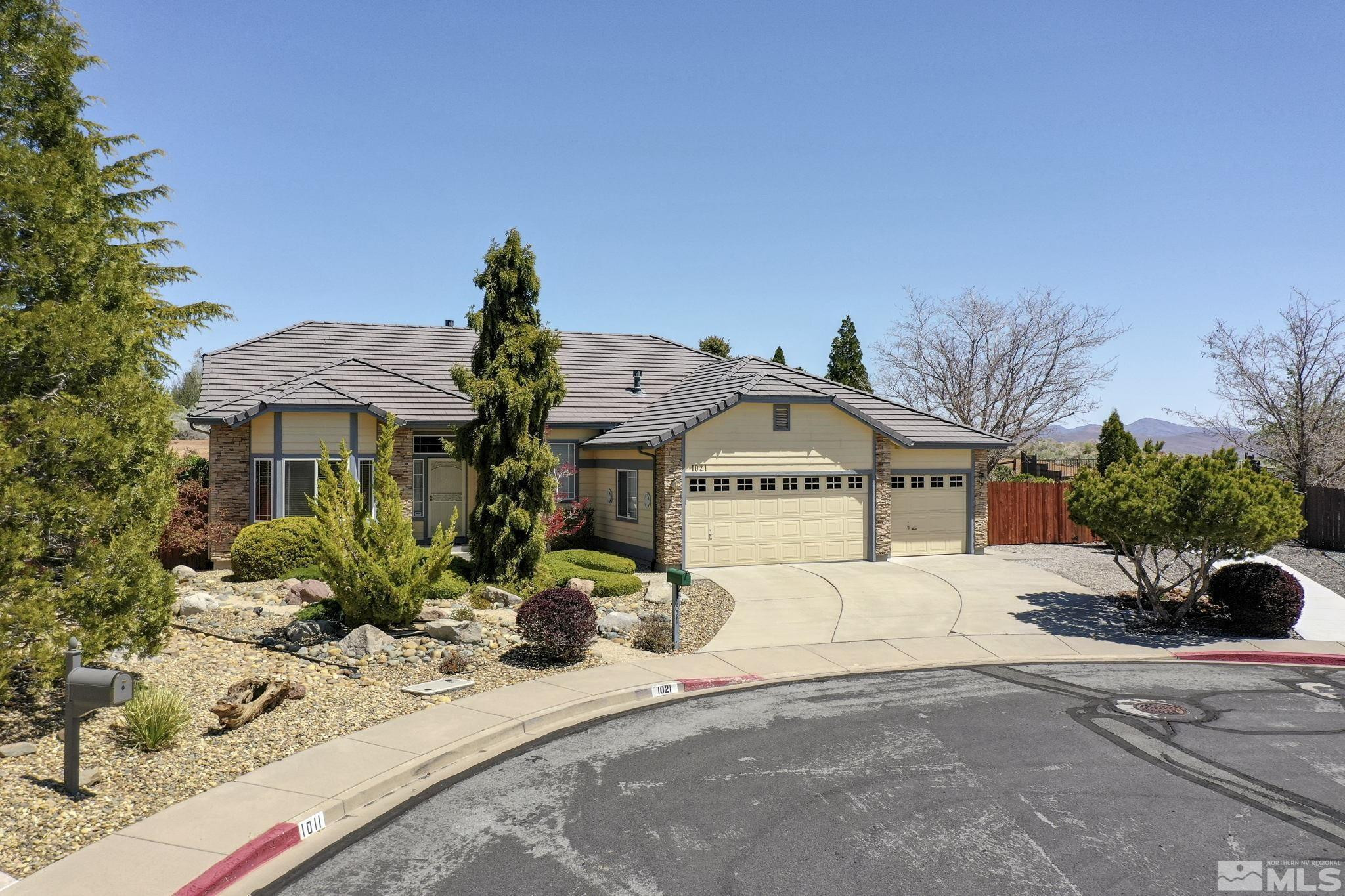 1021 University Place Reno, NV 89512 - Photo 1 of 40 a front view of a house with a yard