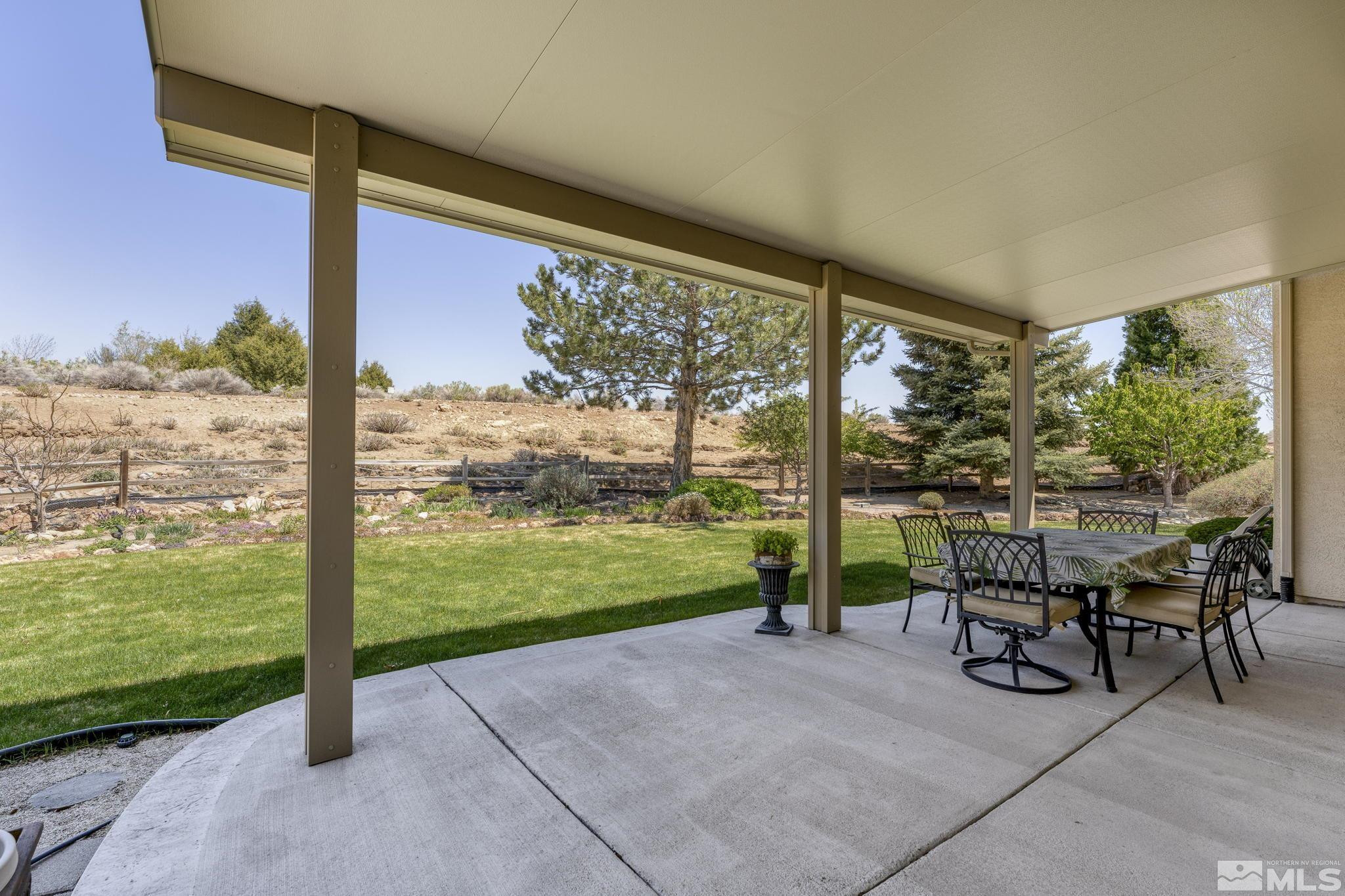 1021 University Place Reno, NV 89512 - Photo 26 of 40 a view of a patio with chairs and table in patio