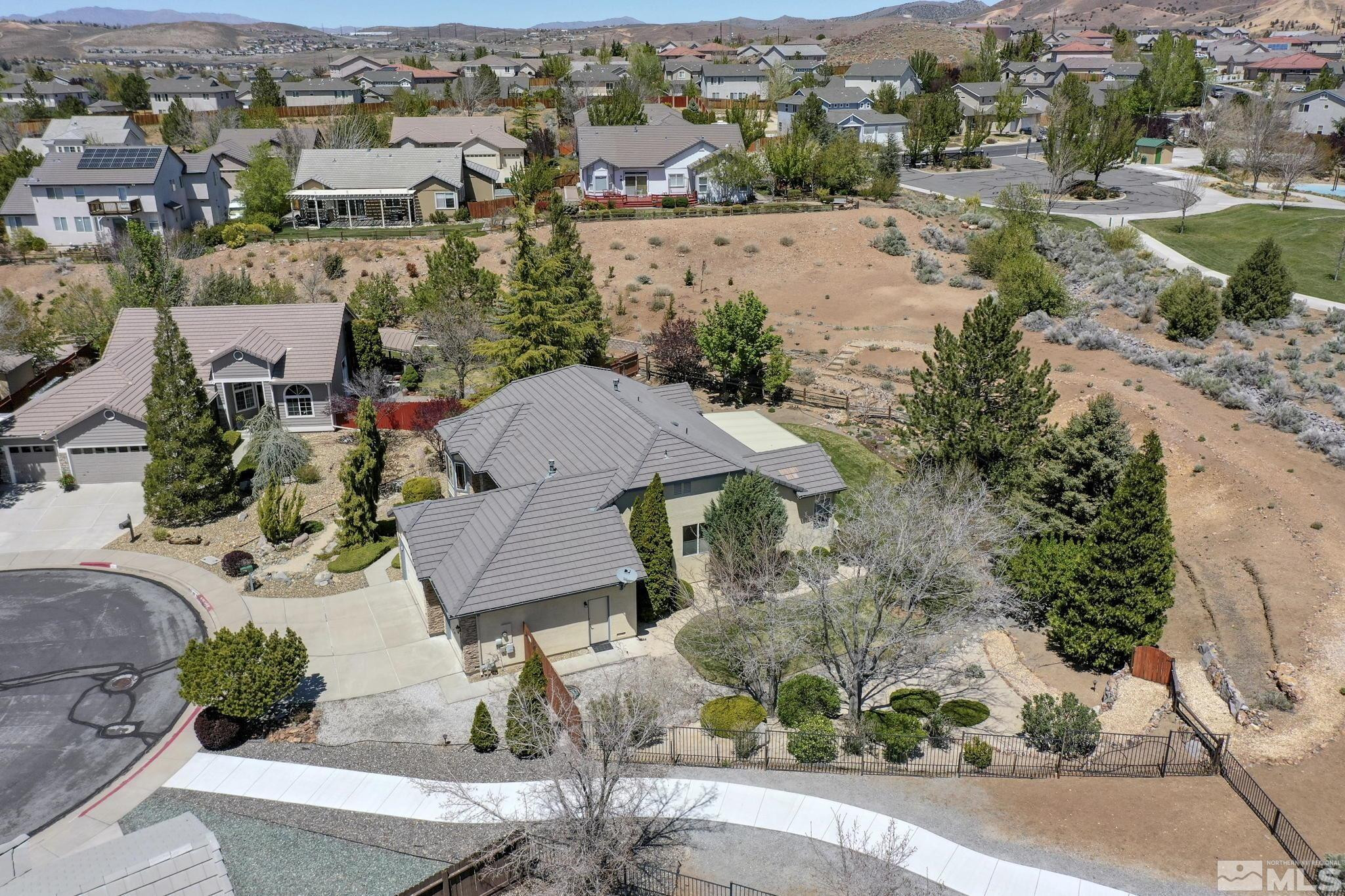 1021 University Place Reno, NV 89512 - Photo 36 of 40 an aerial view of multiple houses with yard