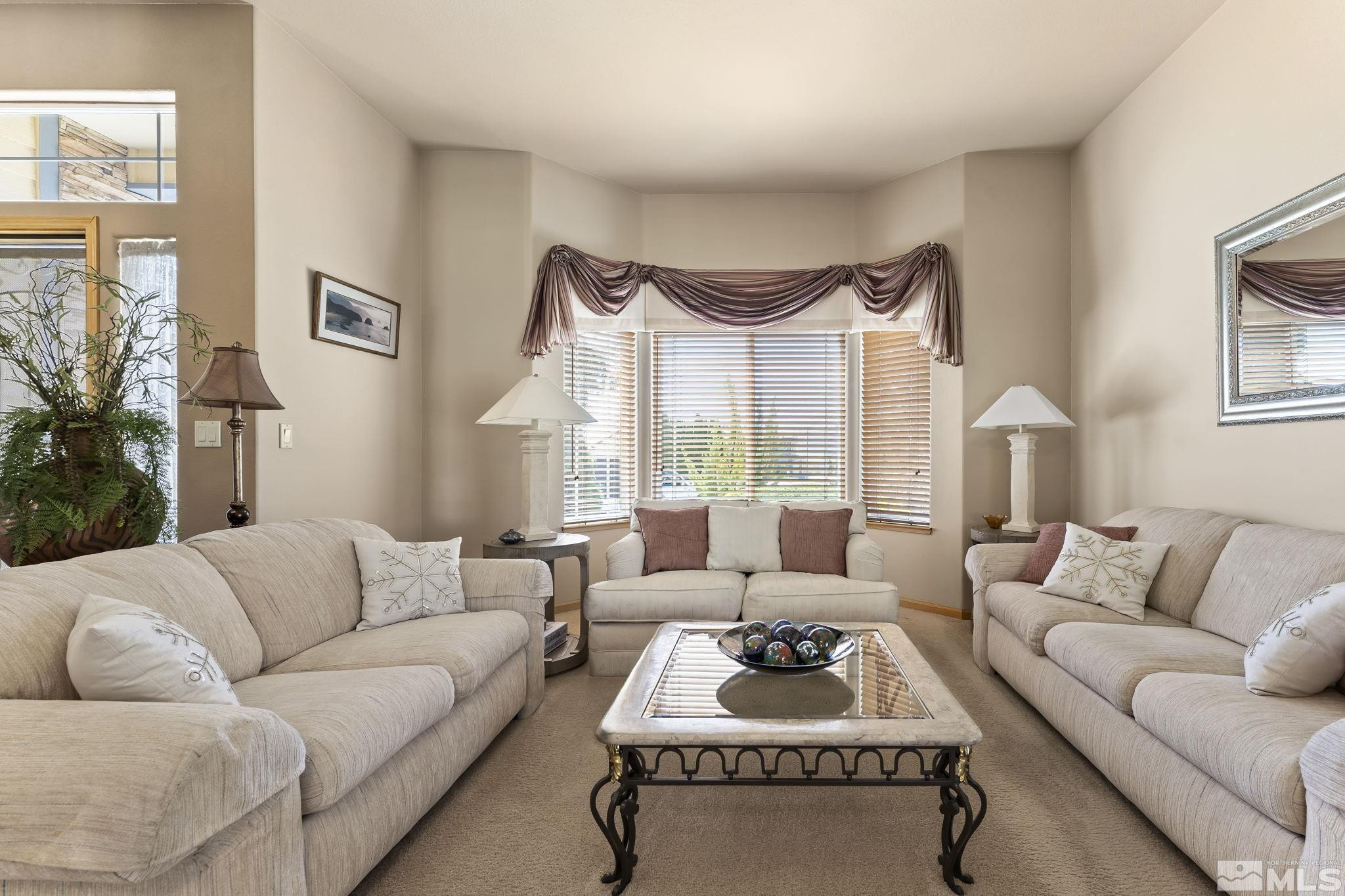 1021 University Place Reno, NV 89512 - Photo 5 of 40 a living room with furniture ceiling fan and a window