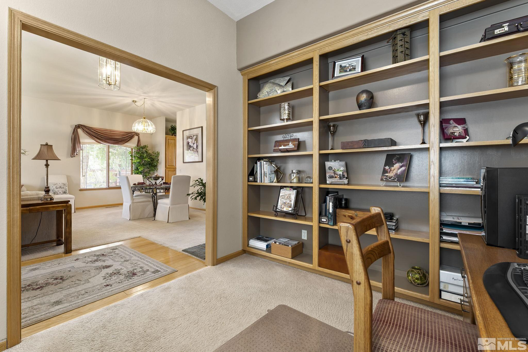1021 University Place Reno, NV 89512 - Photo 9 of 40 a view of a livingroom with workspace and a window