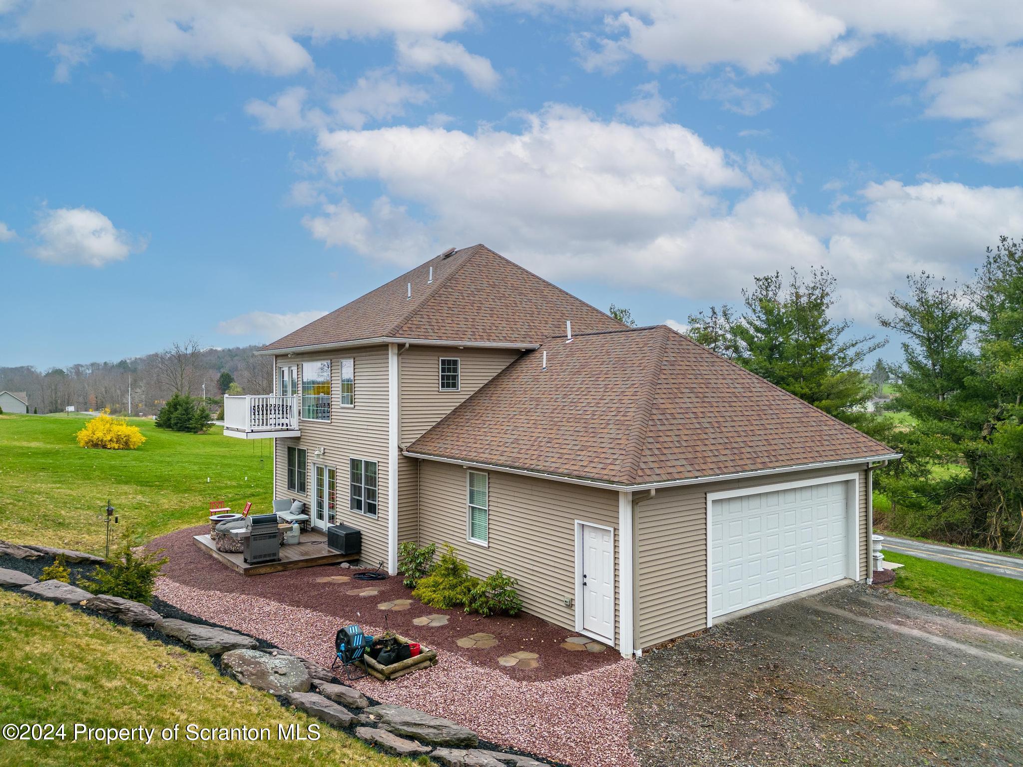 134 Rails Road Tunkhannock, PA 18657 - Photo 2 of 44 front view of a house with yard and a garden