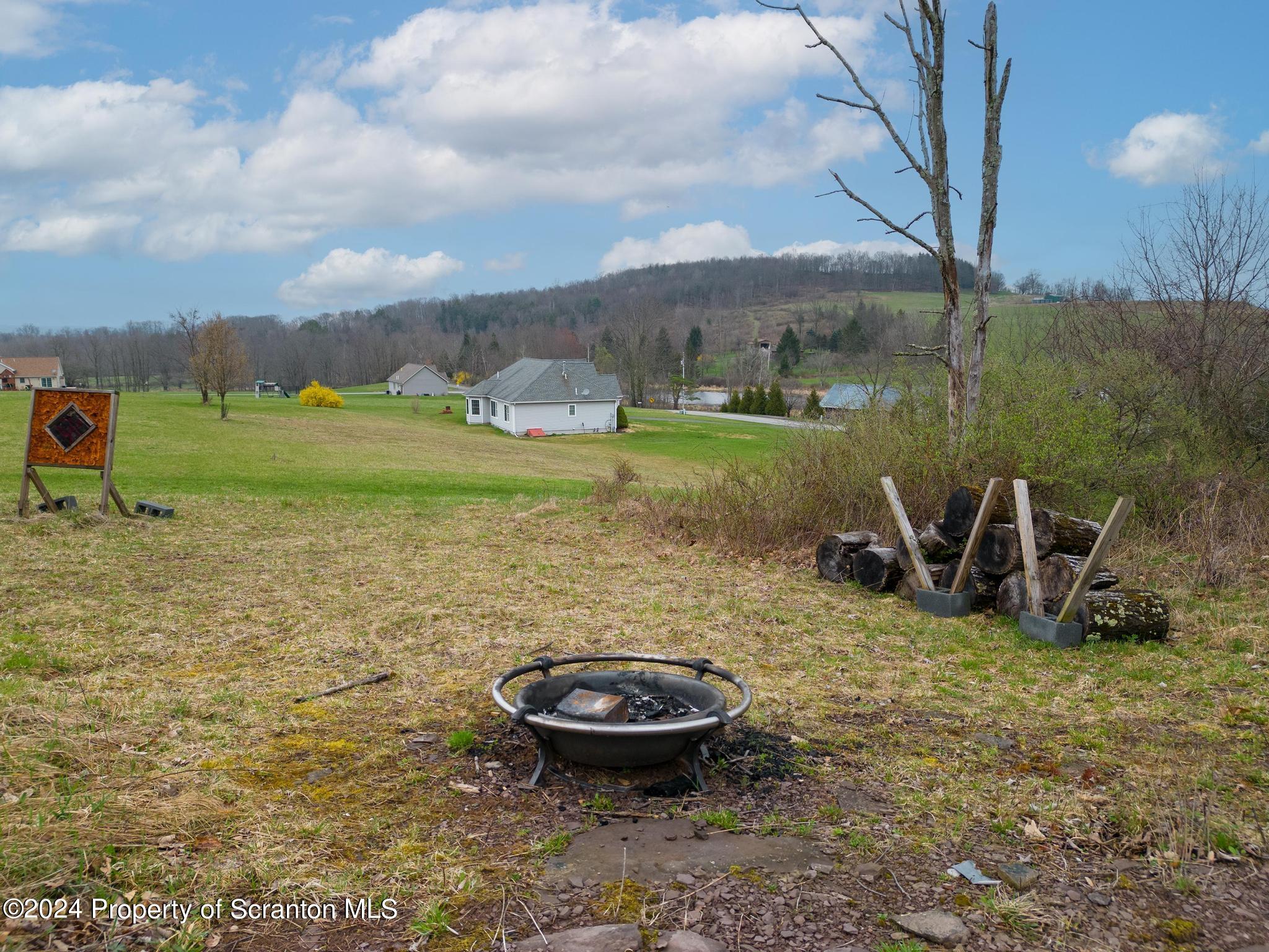 134 Rails Road Tunkhannock, PA 18657 - Photo 8 of 44 a view of a backyard with table and chairs