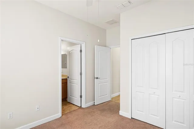 a view of a hallway with closet area