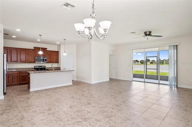 a view of a kitchen with a sink and microwave