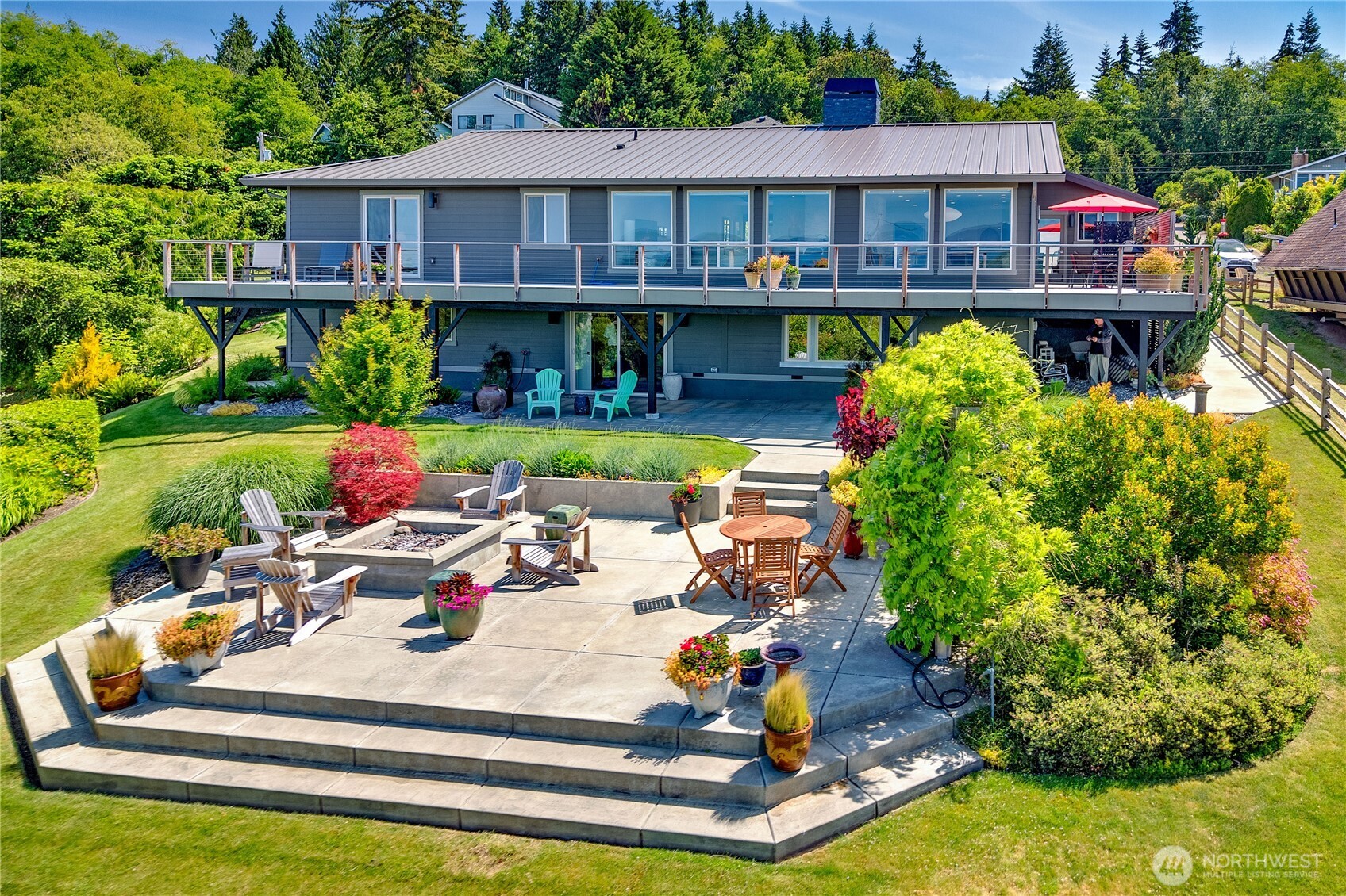 37709 Olympic View Road Northeast Hansville, WA 98340 - Photo 37 of 40 a front view of house with yard and seating area