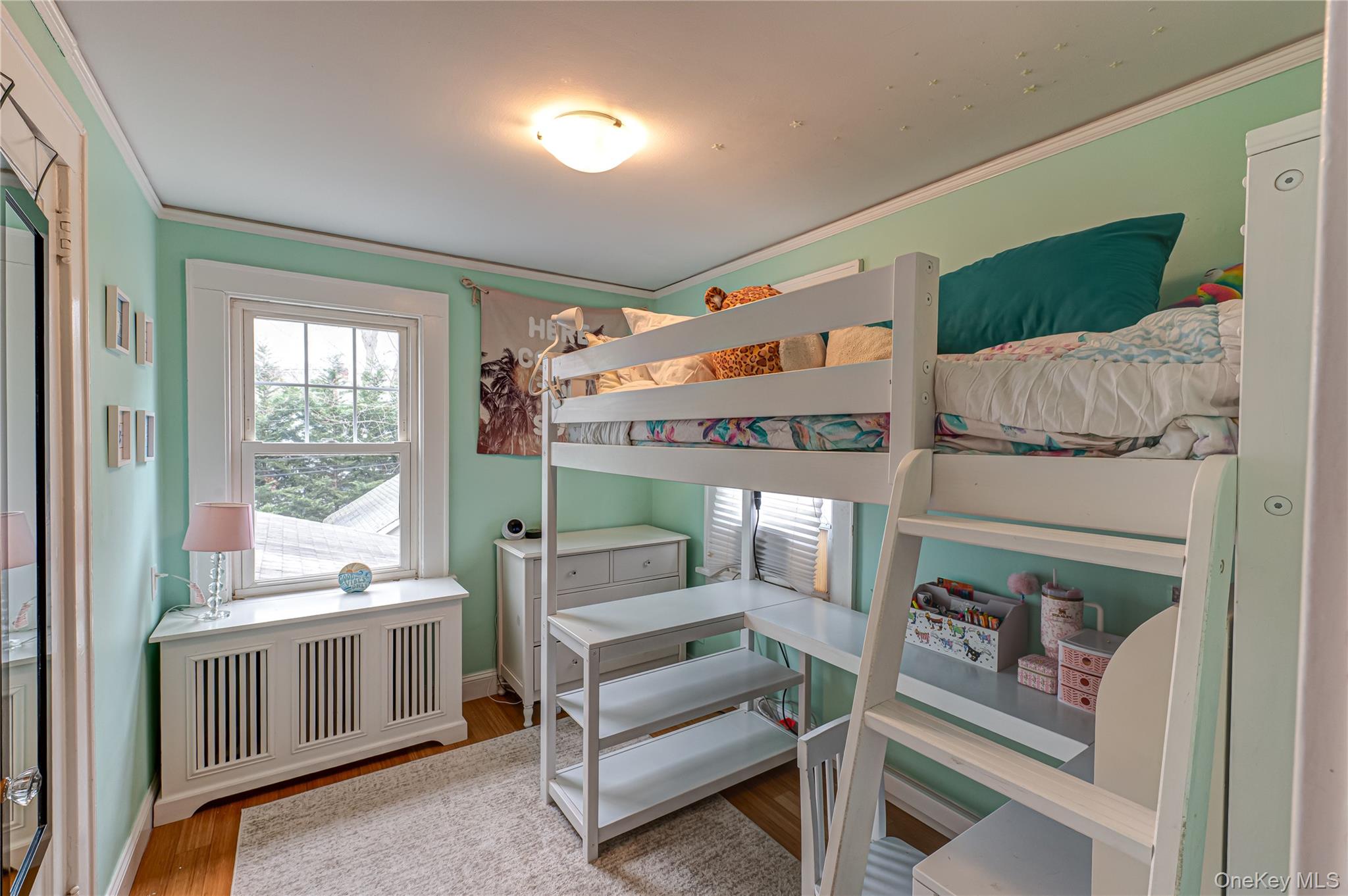 75 Bar Beach Road Port Washington, NY 11050 - Photo 18 of 30 a bedroom with furniture and a window
