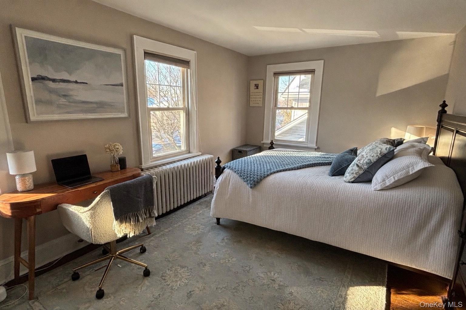 75 Bar Beach Road Port Washington, NY 11050 - Photo 20 of 30 a bedroom with a bed chair and window