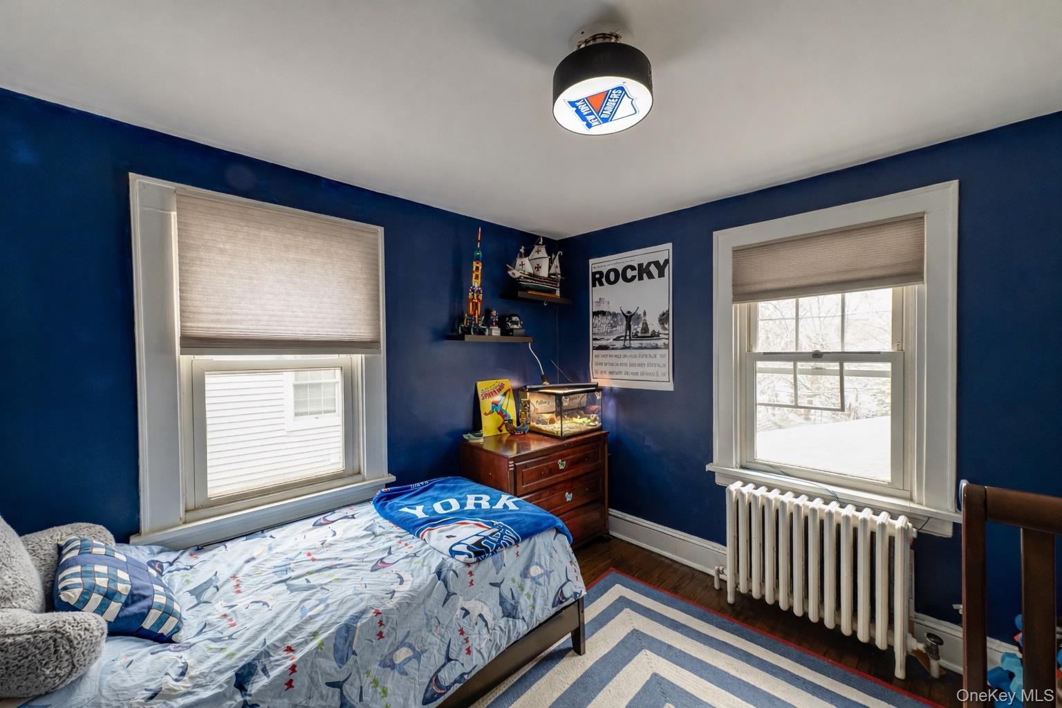 75 Bar Beach Road Port Washington, NY 11050 - Photo 21 of 30 a bedroom with a bed and a window