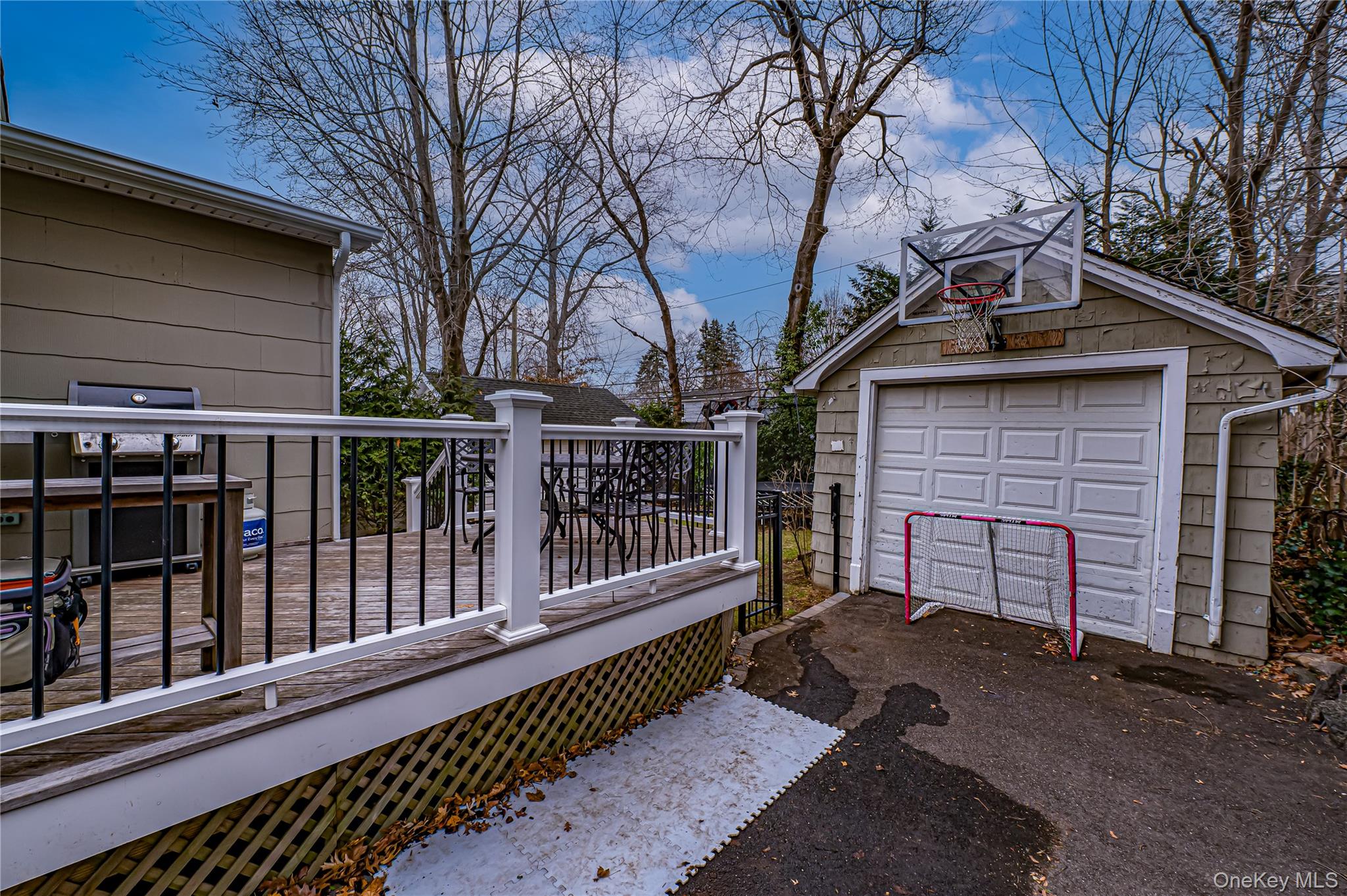 75 Bar Beach Road Port Washington, NY 11050 - Photo 25 of 30 a front view of a house with a small yard