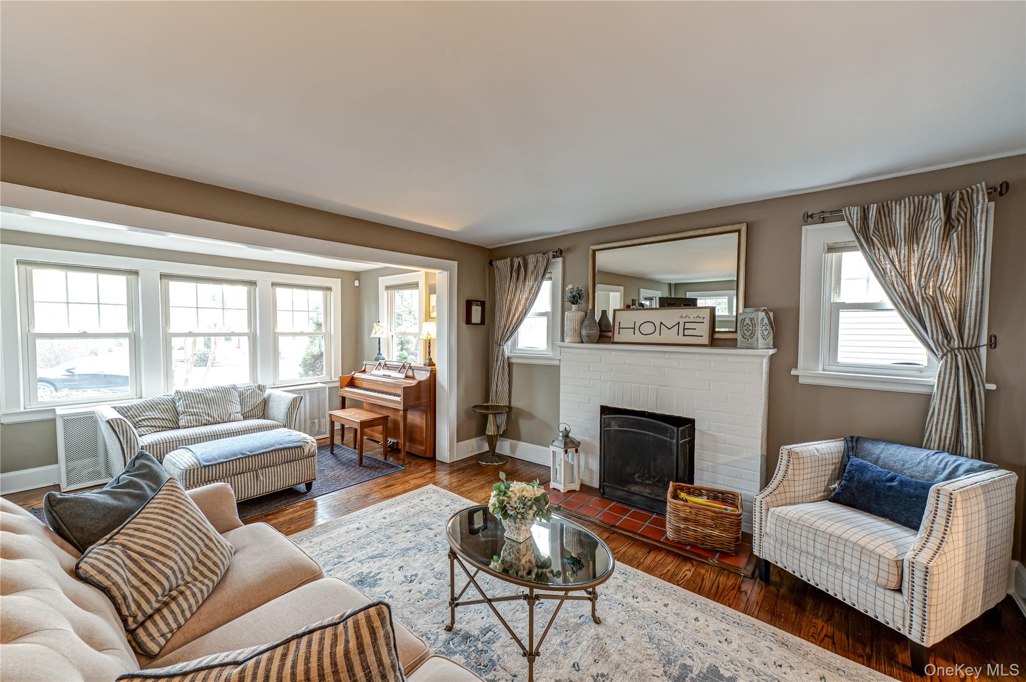 75 Bar Beach Road Port Washington, NY 11050 - Photo 5 of 30 a living room with furniture and a fireplace