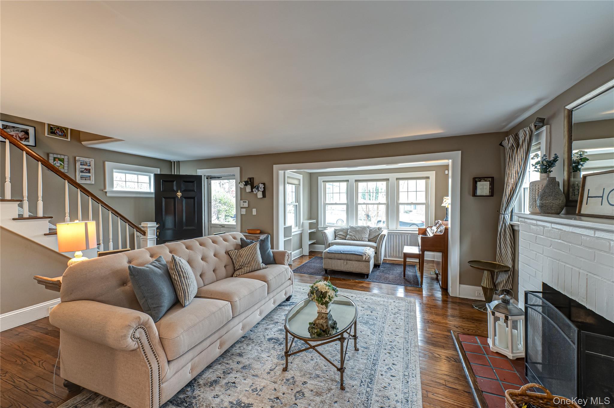 75 Bar Beach Road Port Washington, NY 11050 - Photo 7 of 30 a living room with fireplace furniture and a flat screen tv